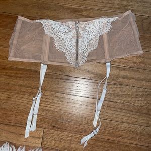 Nude with lace garter belt